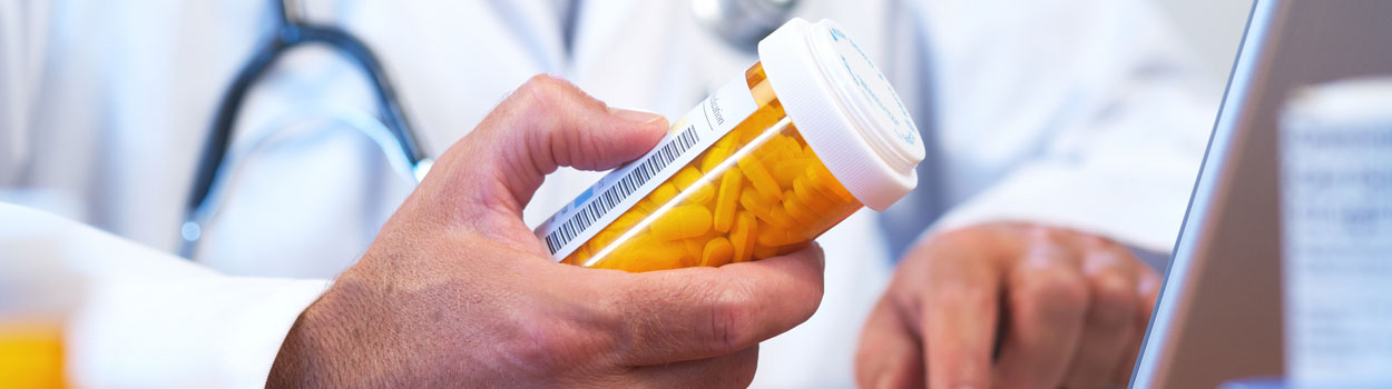 Doctor with Prescription Bottle